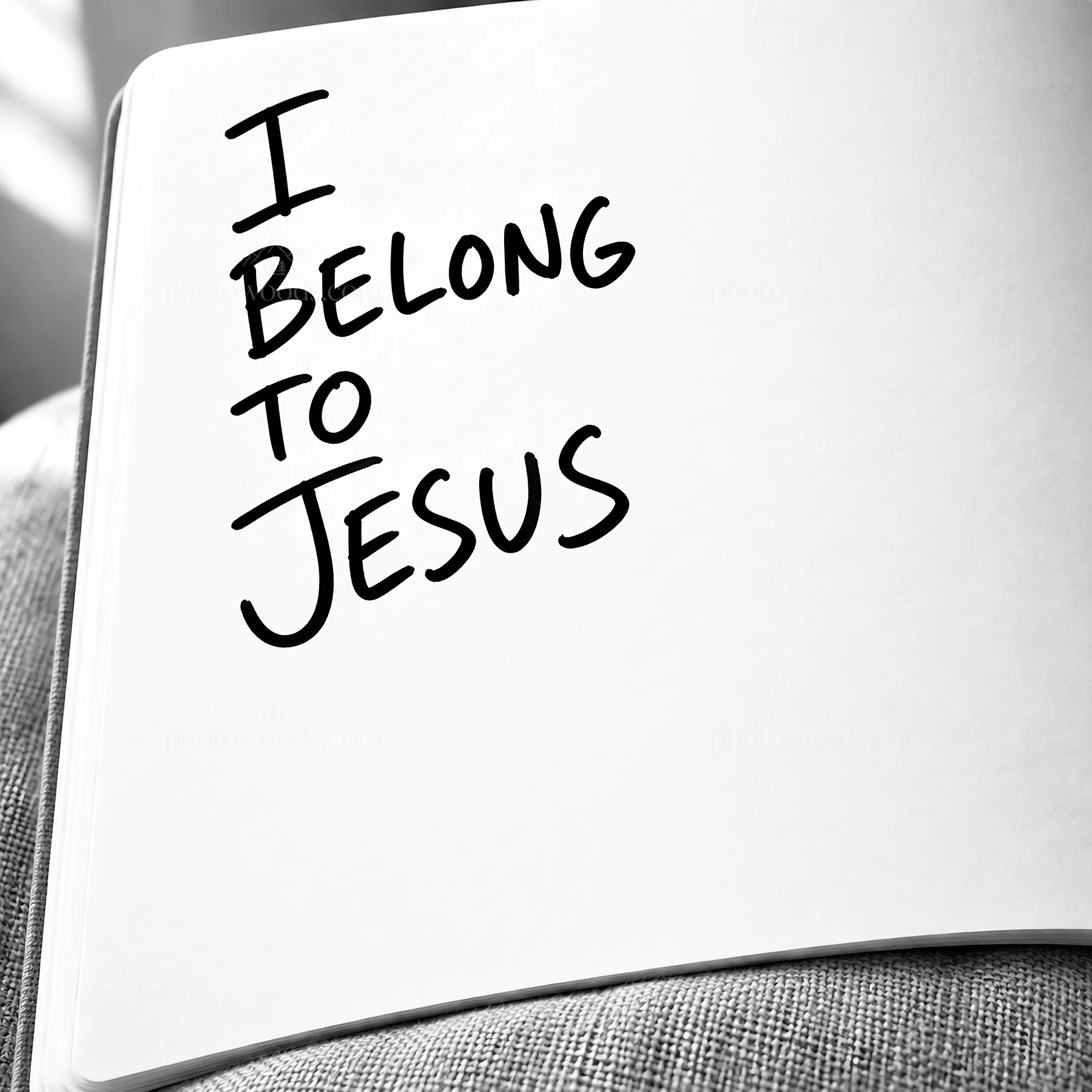 I belong to Jesus written in a notebook - AI-generated stock image
