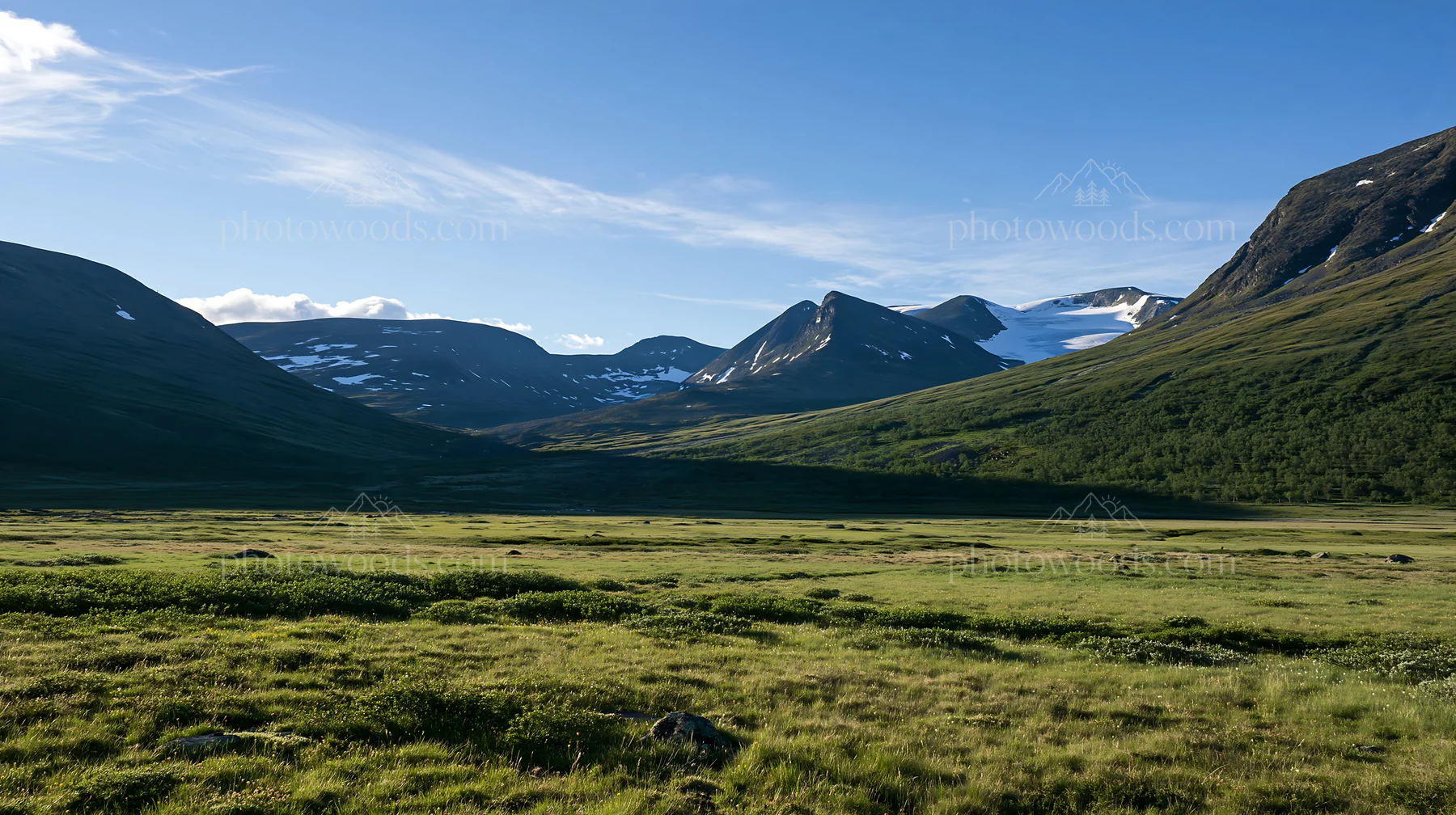 Sunbeams shining over Jotunheimen valley meadow - AI-generated stock image