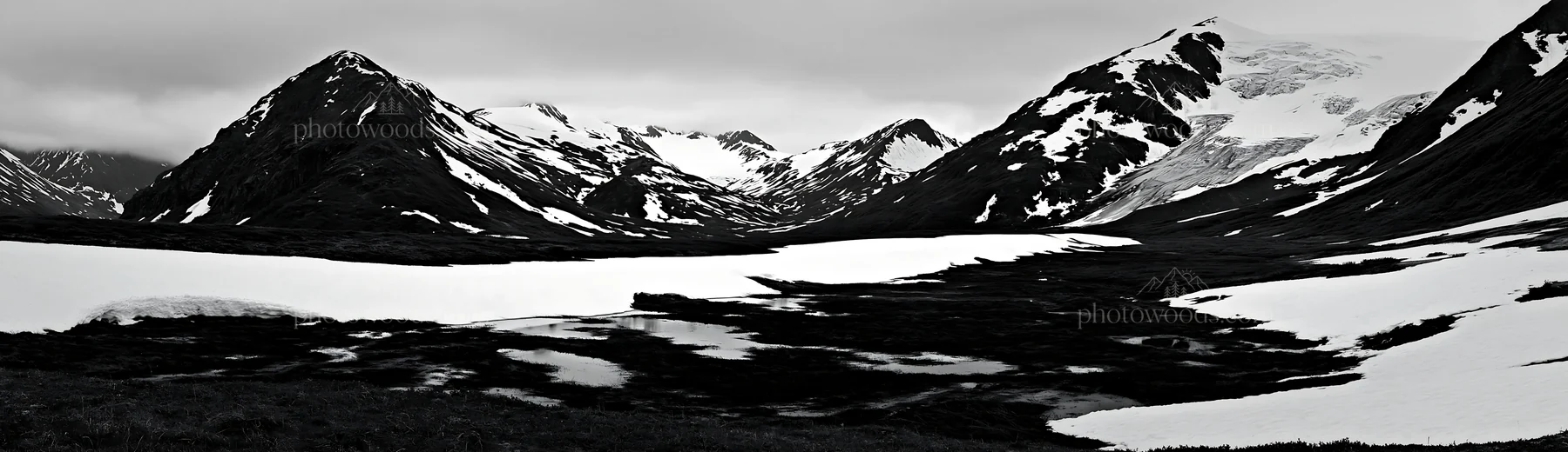 Snowmelt meadow with mountains in black and white landscape - AI-generated stock image