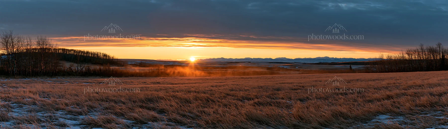Frosty meadow at sunrise with mountain backdrop - AI-generated stock image