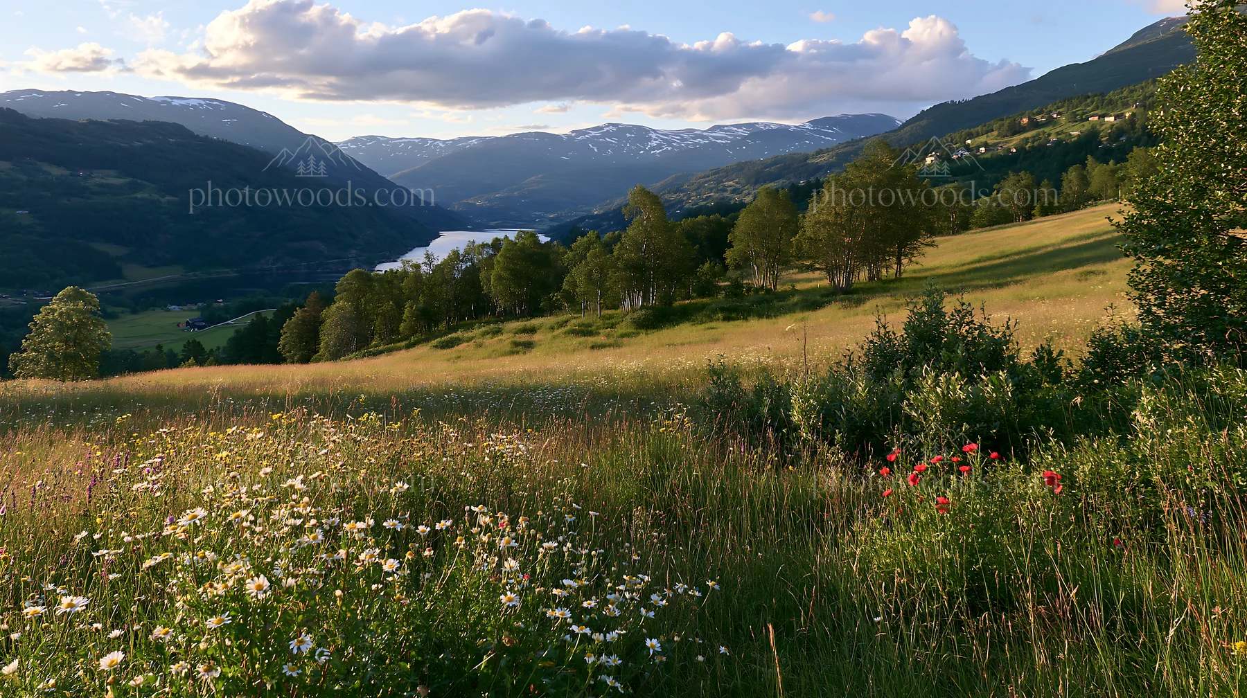 Meadow in rolling valley with river and mountains in background - AI-generated stock image