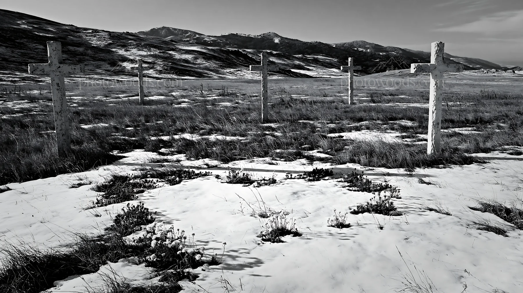 Multiple Christian crosses in snowy meadow landscape - AI-generated stock image