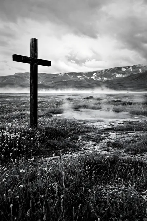 Wooden Christian cross in hot spring meadow - AI-generated stock image