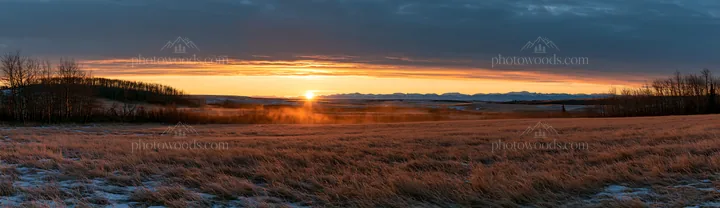 Frosty meadow at sunrise with mountain backdrop - AI-generated stock image