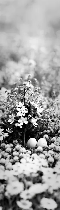 Easter egg tree in a meadow with flowers - AI-generated stock image