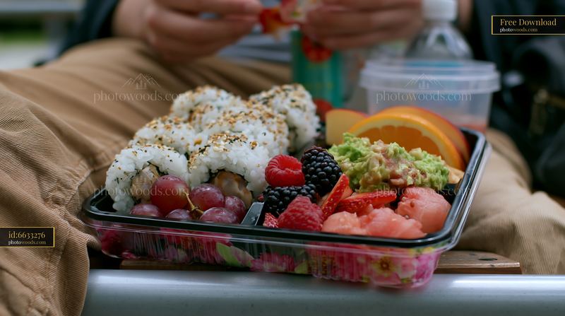 Sushi lunch box with compartments full of fresh ingredients