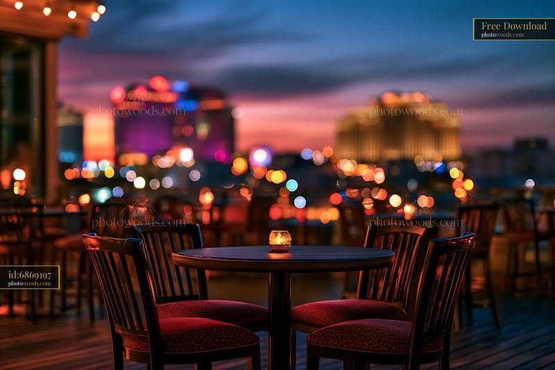 Evening view from a rooftop bar with glowing city lights