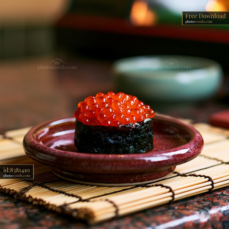 Ikura salmon roe sushi served on a red plate