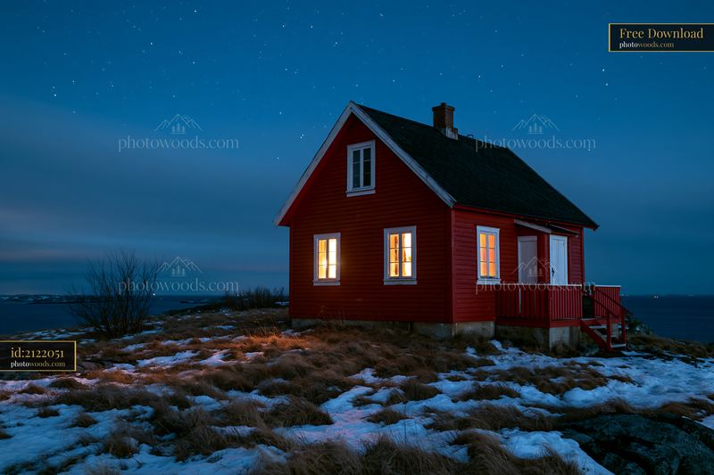 Lighthouse house under stars at night