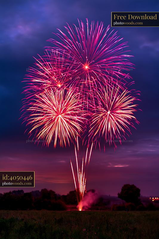Firework Display Over Dark Countryside at Sunset