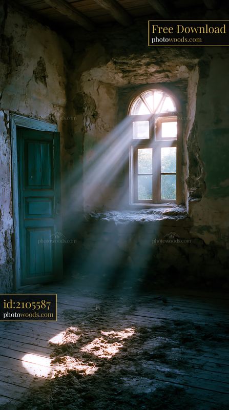 Light Beams Shining Through a Window in a Crumbling Adobe House
