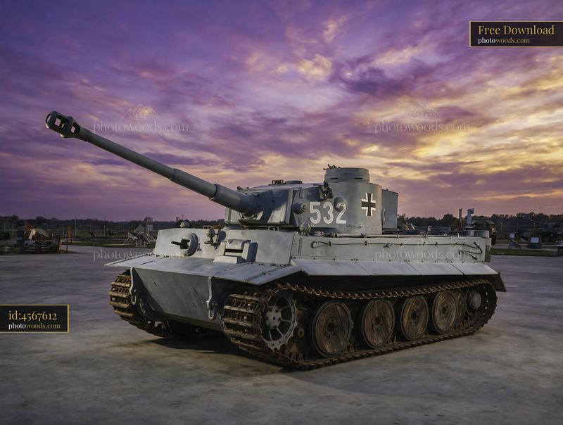 Panzer tank museum display beneath a dramatic sunset sky