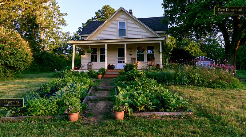 Restored farmhouse exterior with gardens and landscaping