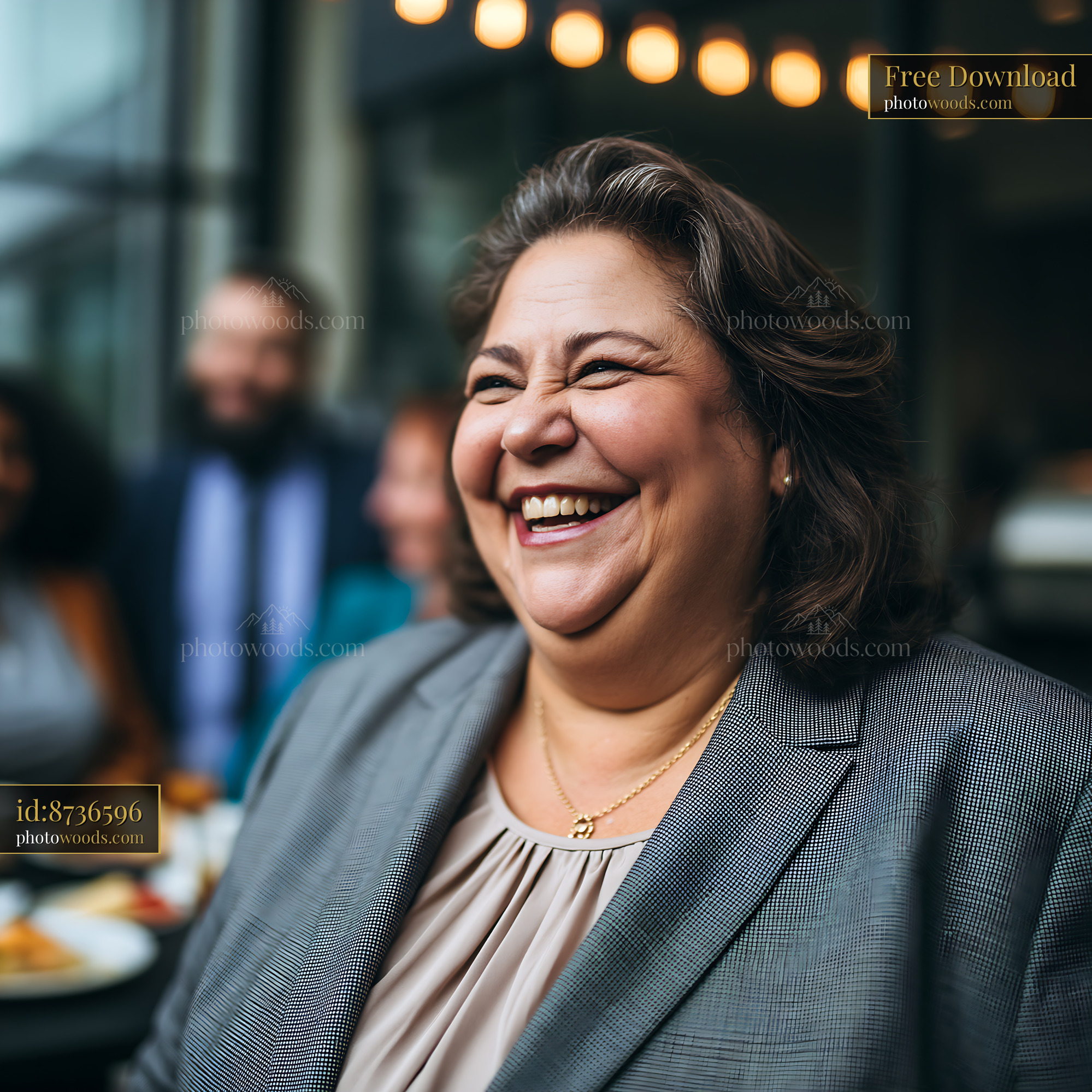 Plus Size Businesswoman Laughing in a Tailored Suit With Colleagues