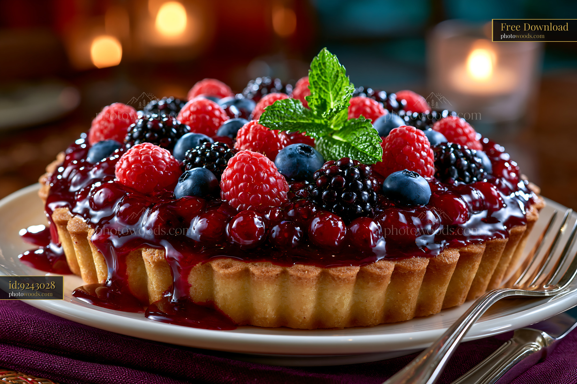 Berry Tart With Glossy Glaze and Mint on a Plate