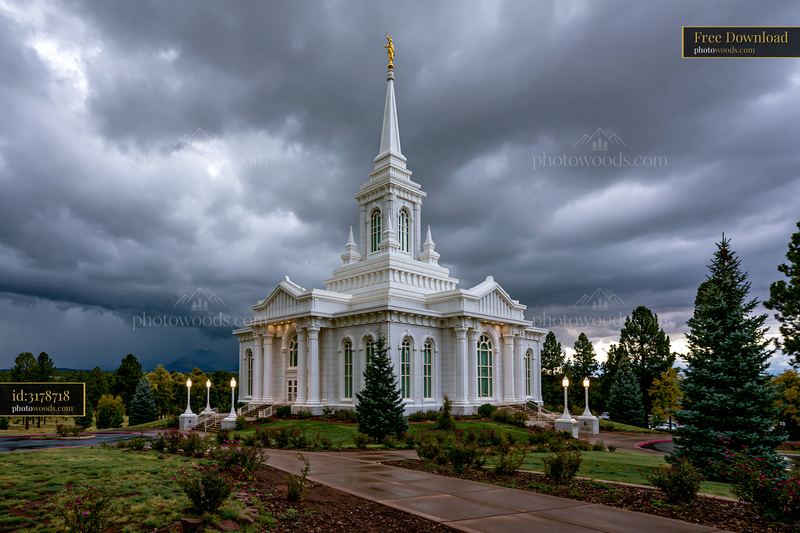 White temple with spire beneath dramatic storm clouds