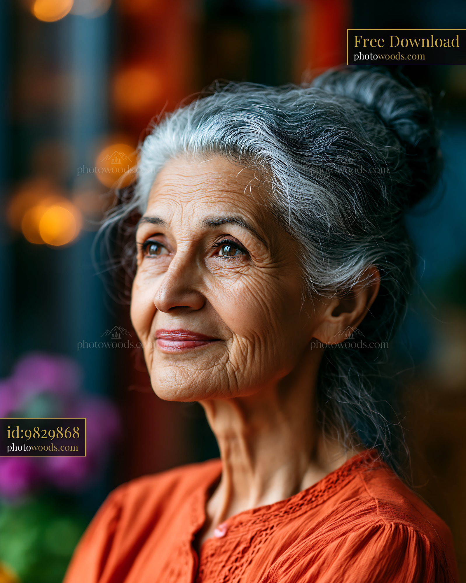 Woman With Gray Hair Looks Thoughtfully Outside a Window