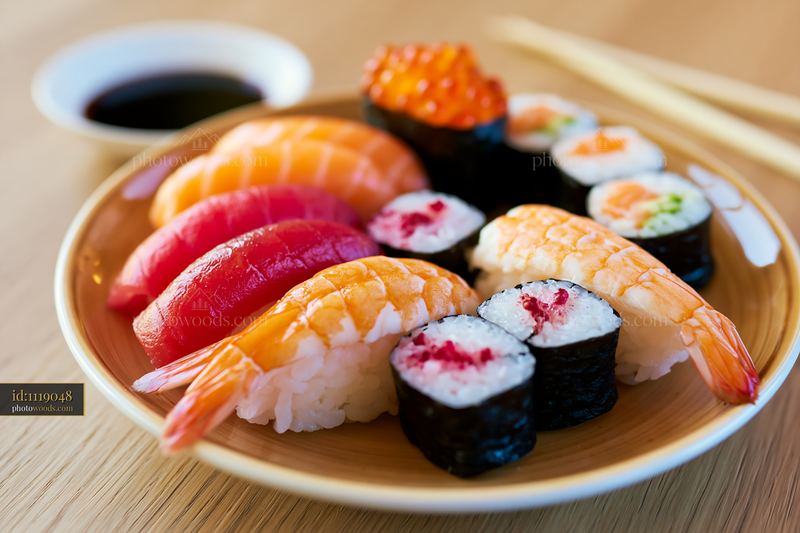 Sushi tasting selection close-up on a wooden table