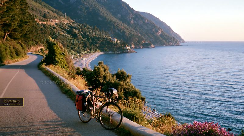Coastline with sheltered bay and bike on the road