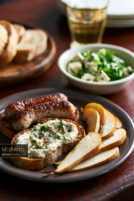 Breakfast plate with sausage and side of salad and fruit