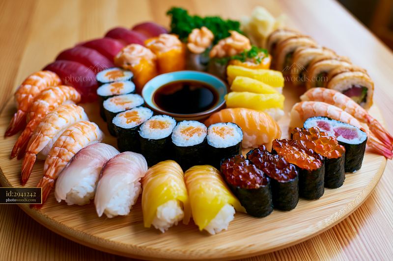 Sushi tasting selection close-up on wooden platter