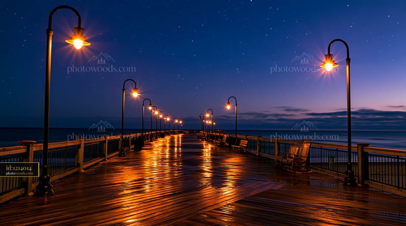 Starry night over a coastal boardwalk with lit lampposts