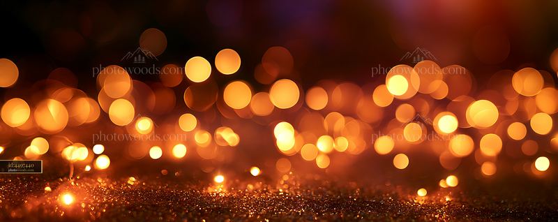 Warm glow of blurred lights on a dark background