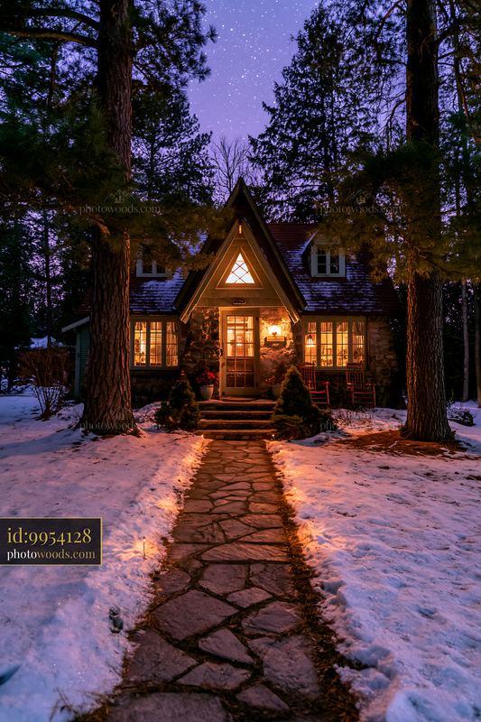 Cottage under stars with a stone path leading to the entrance