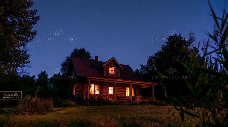 Cottage under stars with an open porch in a peaceful setting