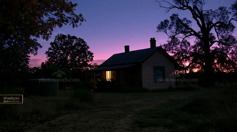 Country home under clear night sky with subtle lighting