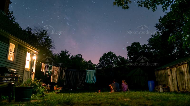 Couple enjoys time together under stars in a rural backyard