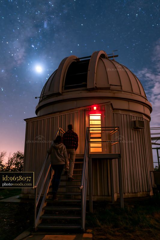 Couple at a remote observatory at night