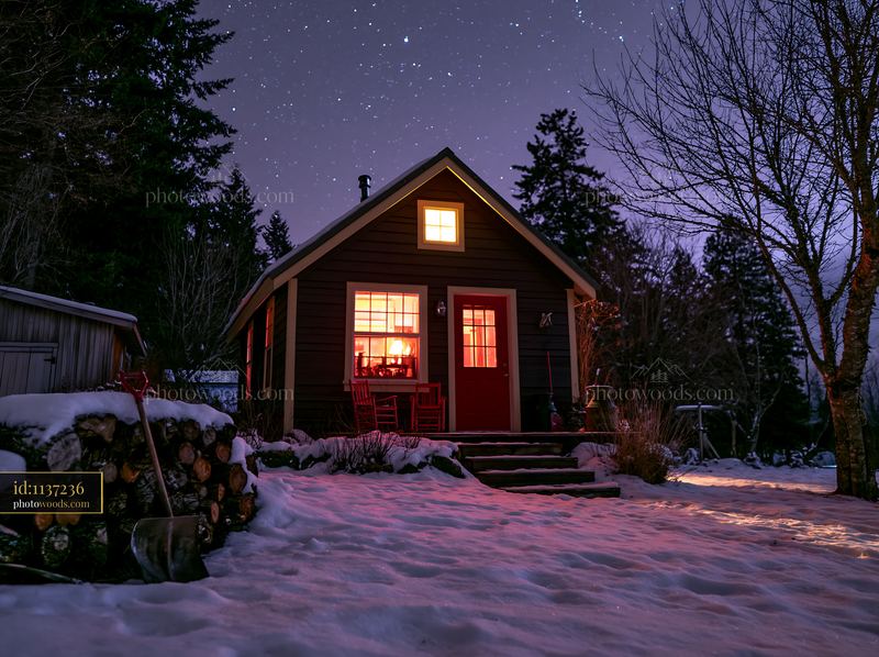 Home illuminated under stars during a clear winter night