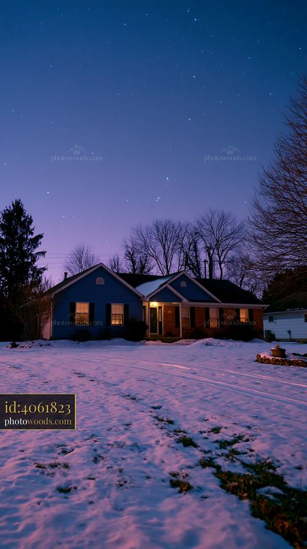 Snowy house under stars at twilight with a clear sky
