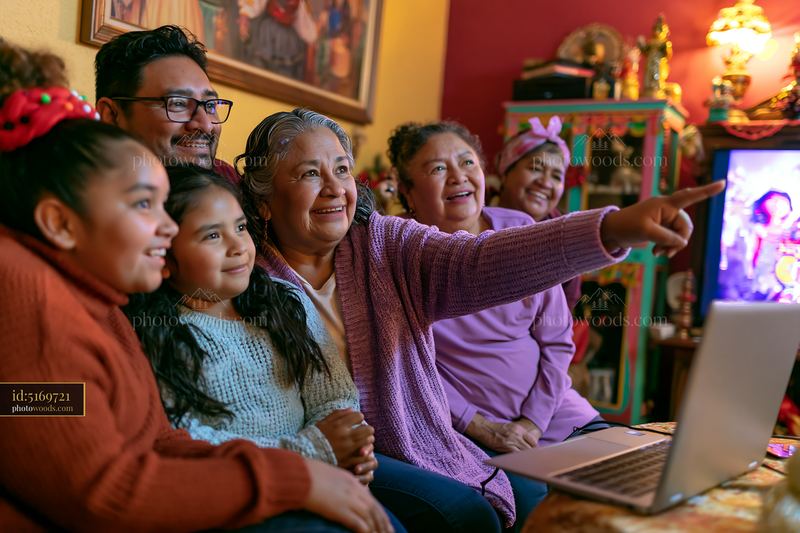 Family watching holiday movie at home with laptop and smiling faces