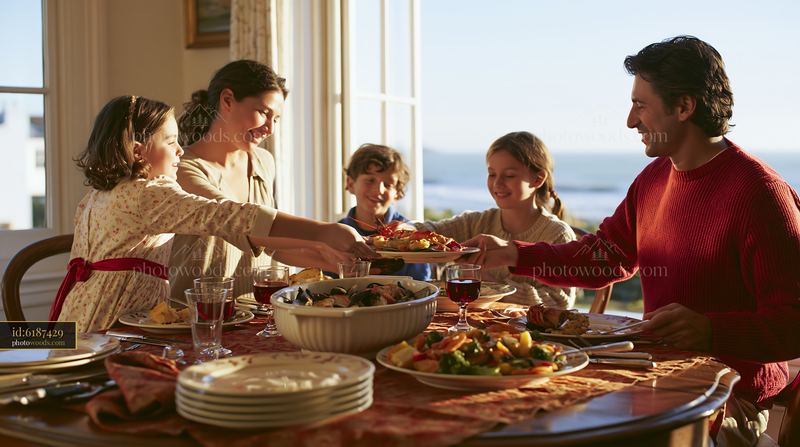 Family serves holiday meal at dining table by the window