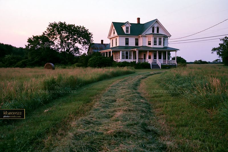 Farmhouse landscape at sunset with grass and open fields