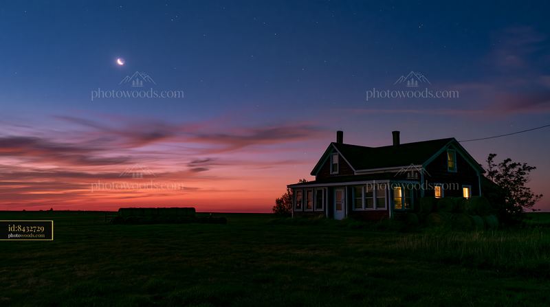 Farmhouse beneath night sky with colorful clouds and stars