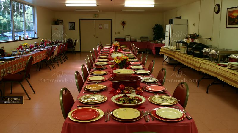Festive dining room set with red tablecloths and decorated tables