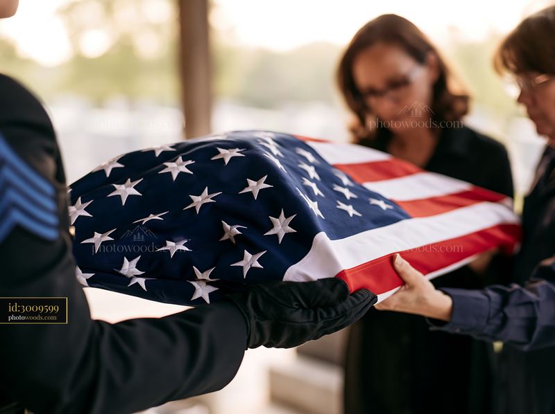 Folded American flag presented to grieving family at memorial service