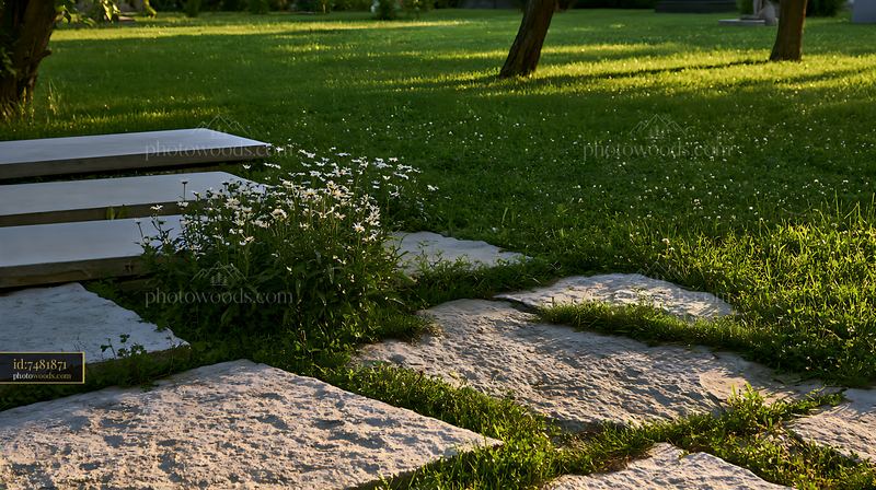 Grave with simple floral decoration in a green outdoor setting