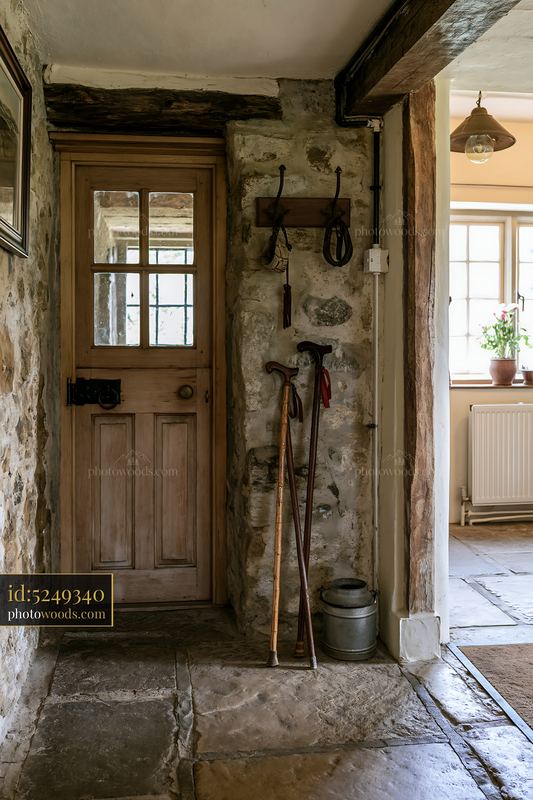 Country house hallway with coat hooks and rustic decor