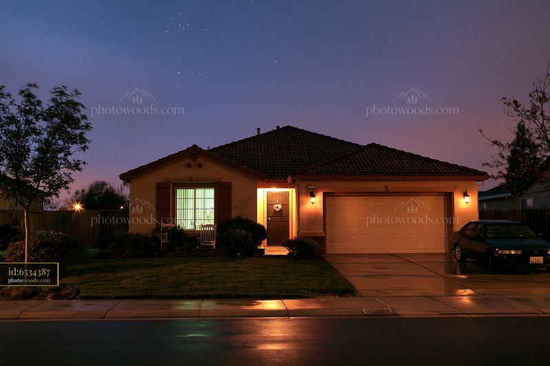 House under stars during blue hour with clear night sky