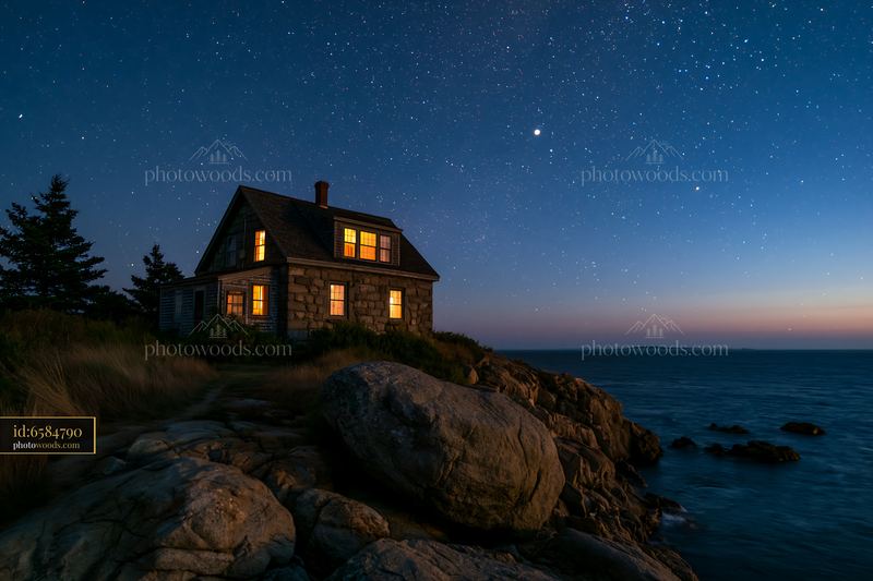 Lighthouse house under stars with rocky coastline at night