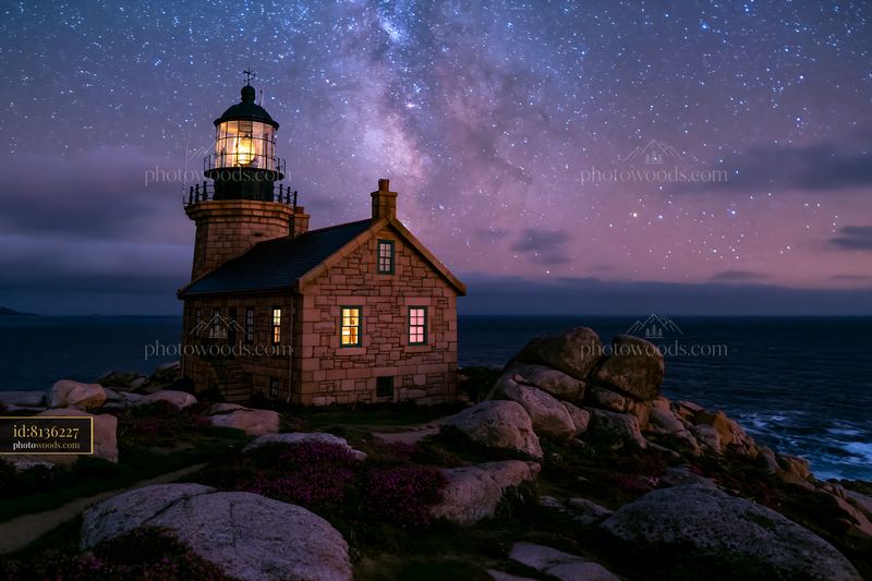 Lighthouse house under stars with Milky Way in the background