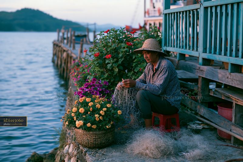 Remote island with colorful flowers and fishing activity by the sea
