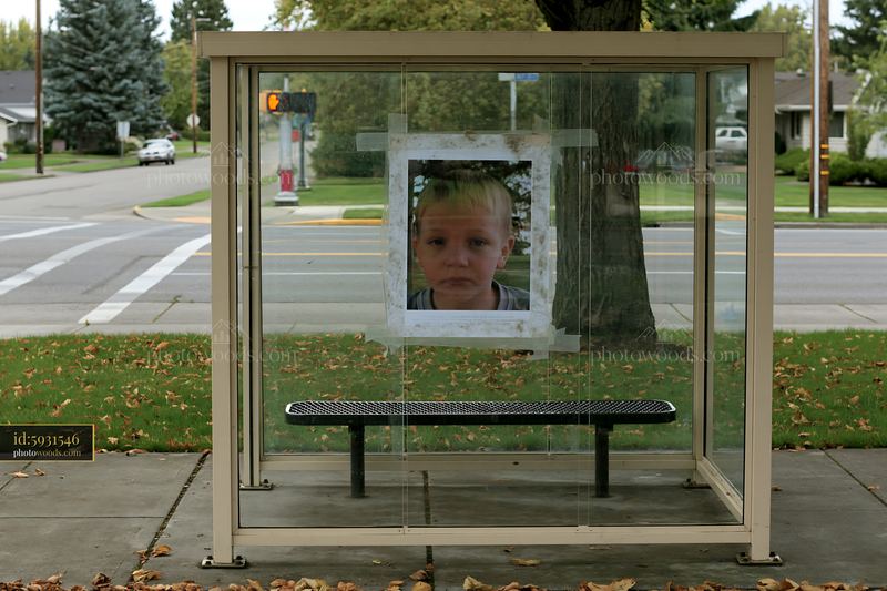 Missing child poster displayed at a bus stop shelter