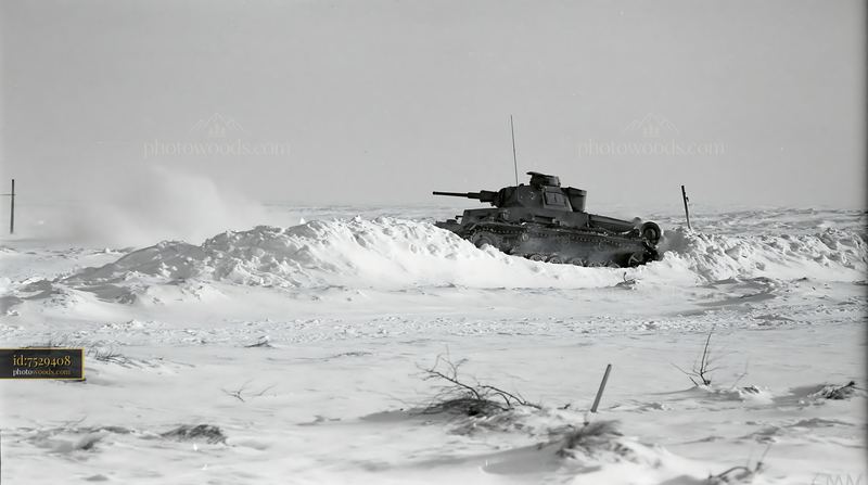 Panzer tank navigating through deep winter snow