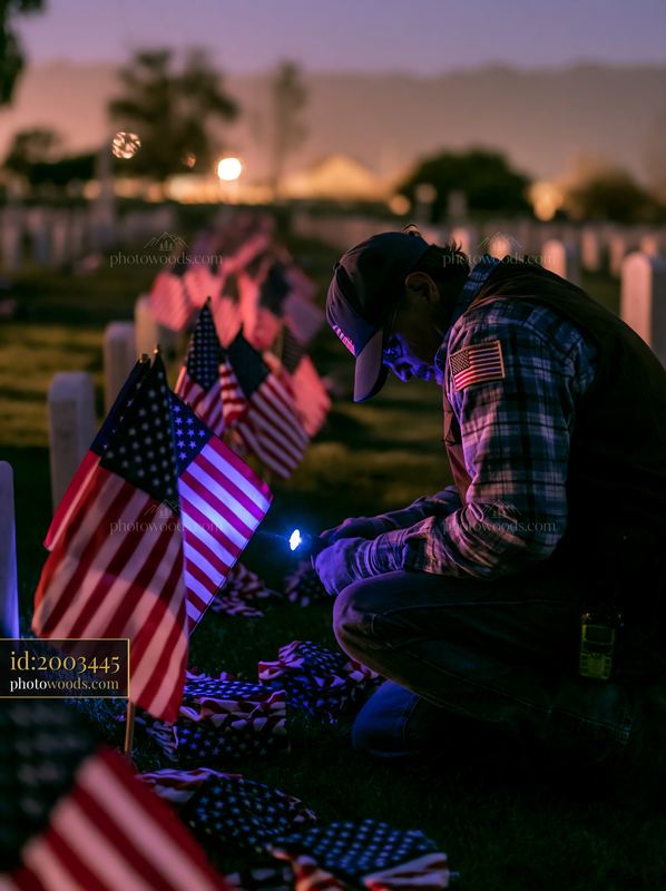 Headstones with folded US flags at night