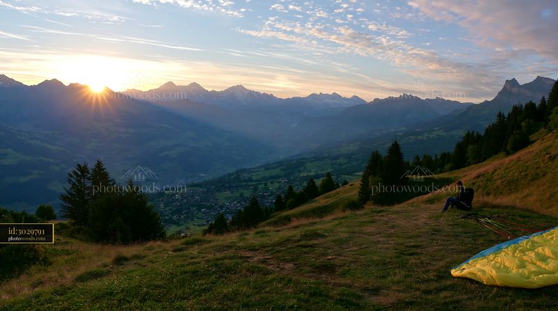 Swiss landscape during golden hour with mountain backdrop